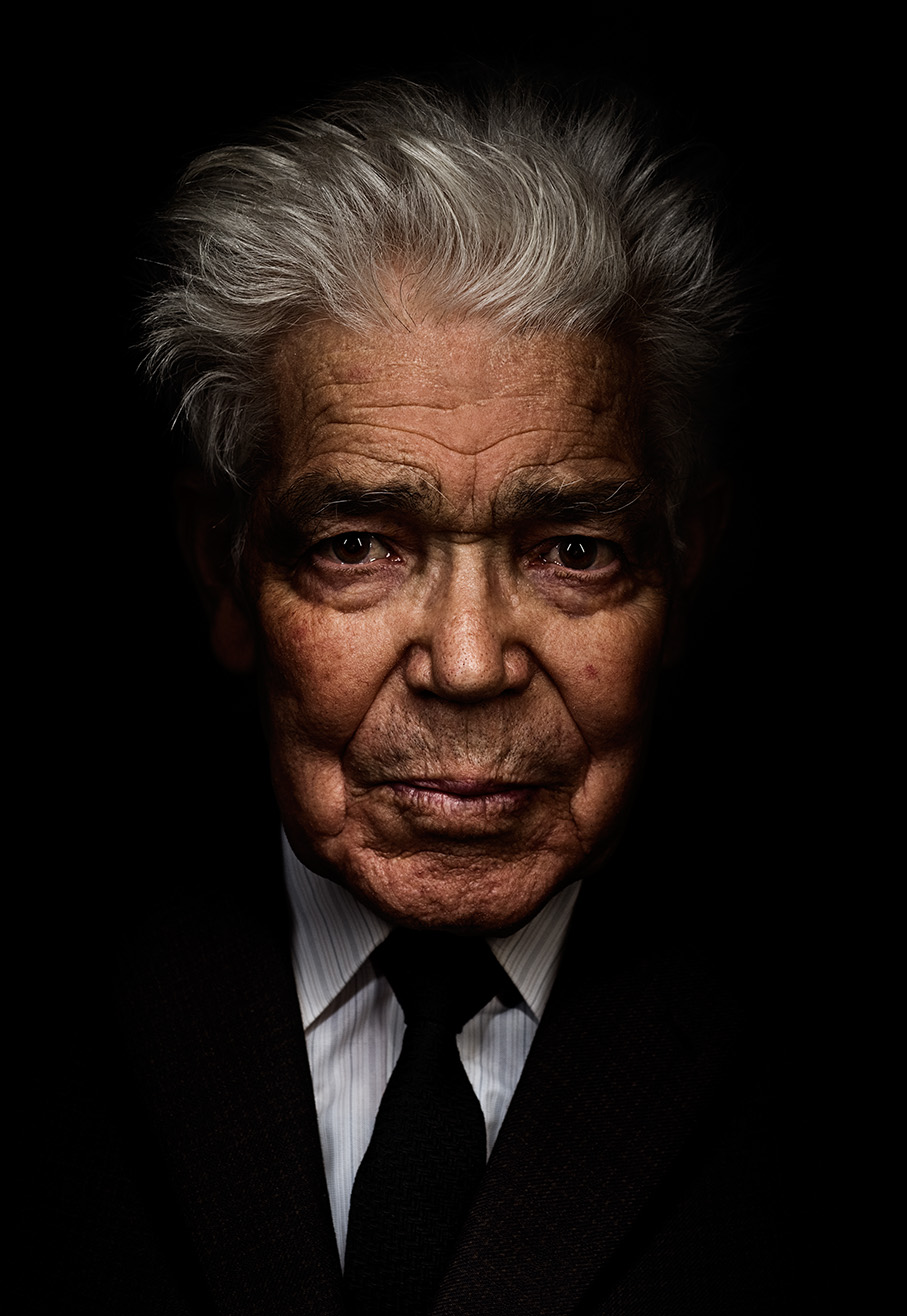 Portrait of an older man against a dark background